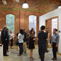 Lots of people in an art gallery 