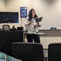 Leslie Sainz reading poetry at Georgia Poetry Circuit