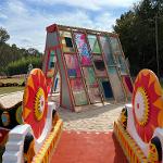 Sculpture of stained glass in the shape of a 3 dimensional triangle