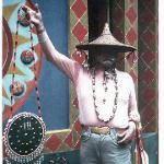 Eddie Owens Martin holding up a bag at Pasaquan