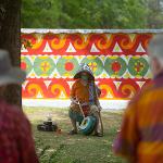 Performer wearing a colorful mask at a Pasaquan event