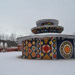 Pasaquan buildings and decorated walls blanketed in snow
