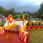 Colorful painted courtyard with sun medallions and wave-patterned benches