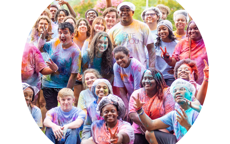 multiple students covered in color party dust