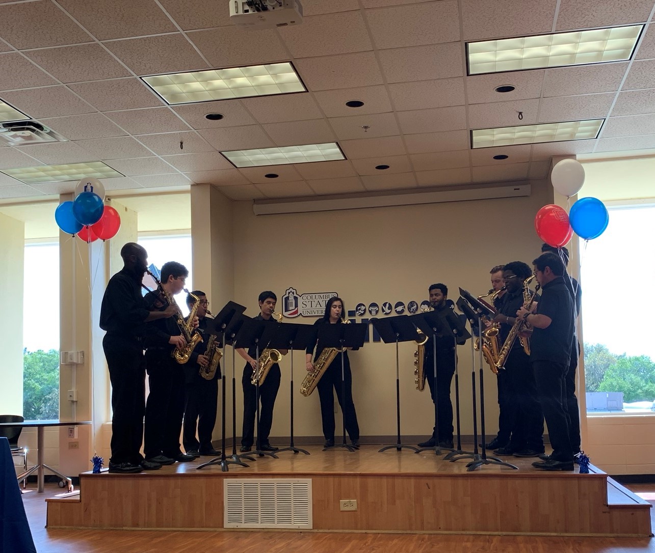 several people playing instruments on stage
