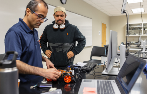 Professor and a student testing a robotics project