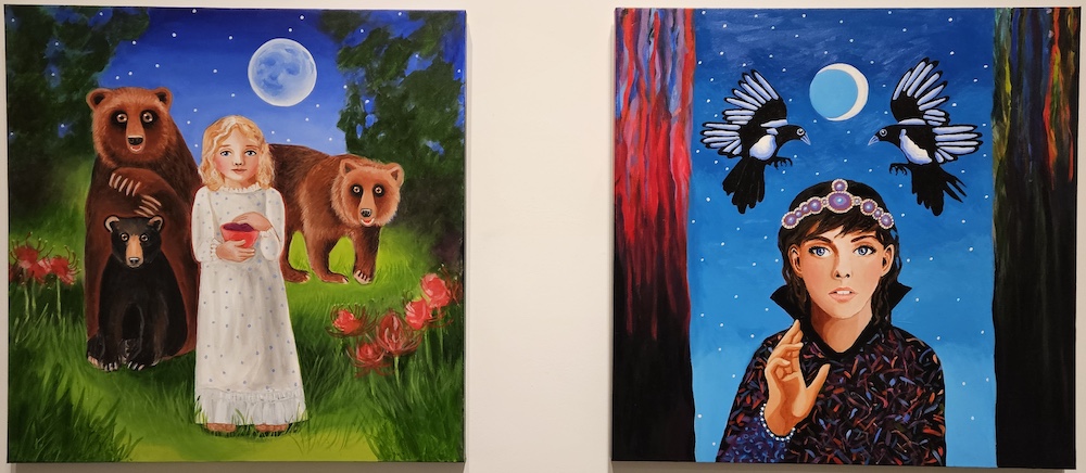 a canvas of artwork hanging on a wall with several color lines on it