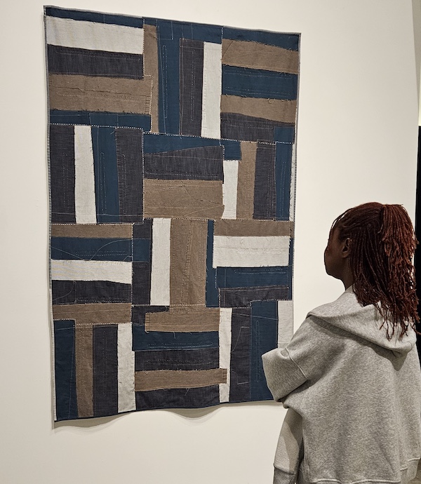 textile pattern of squares and rectangles in navy, black, brown and white