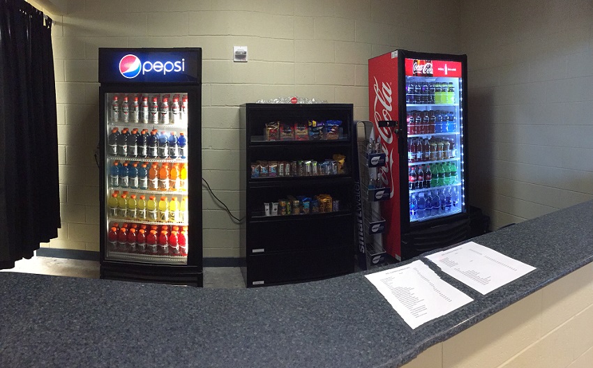 the Rec Express pro shop with a Pepsi cooler, Coca-Cola cooler, and snack cabinet