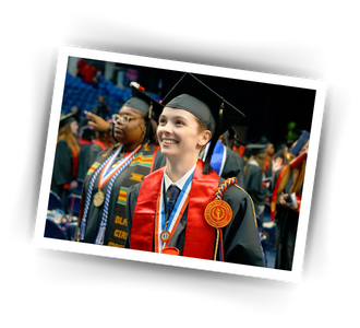 two students in graduation regalia