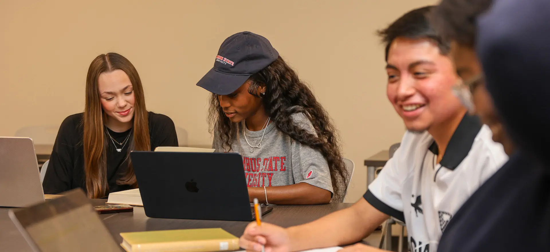 students sitting at a table talking