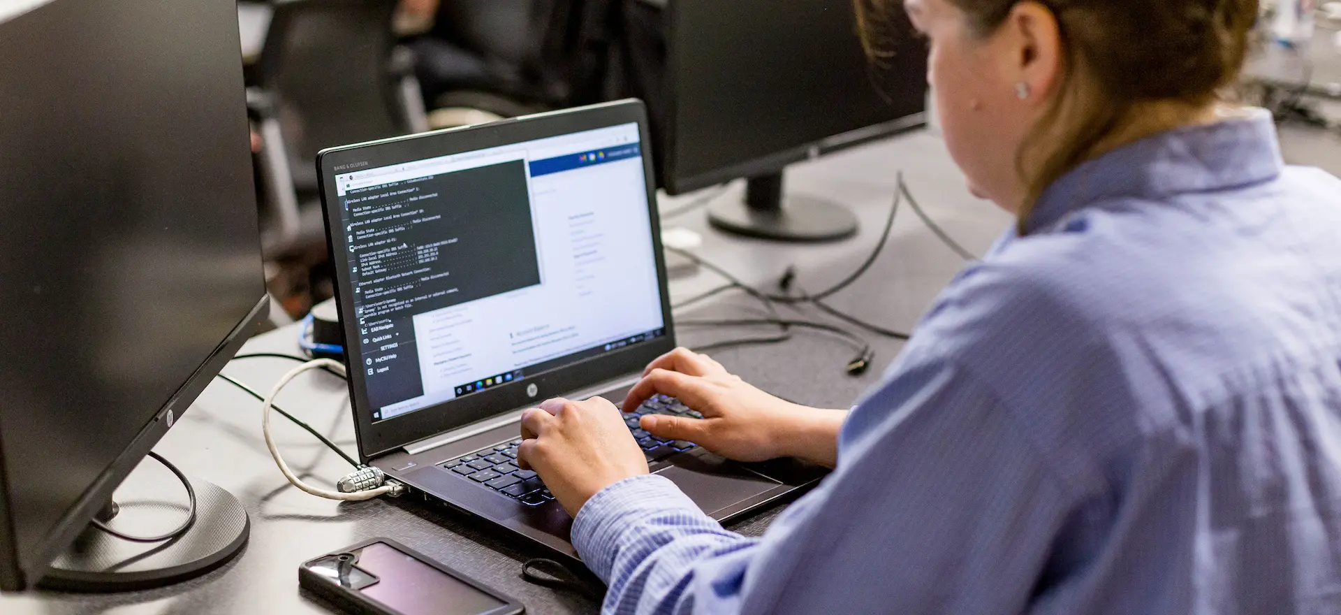 computer science student on her computer