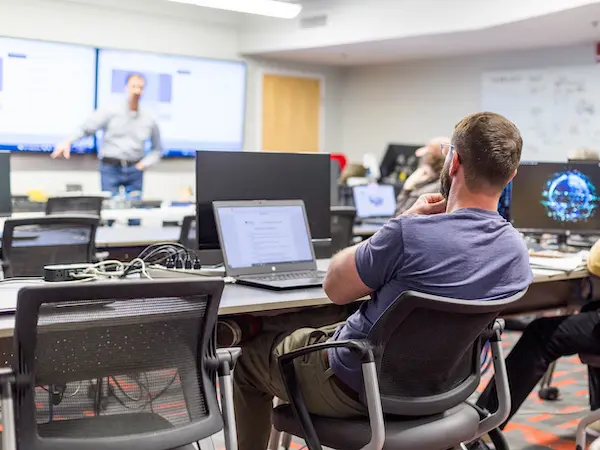 Student in class listening to professor