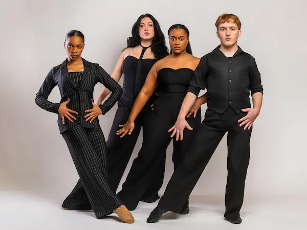 four dance students posing