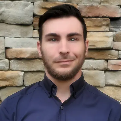 a headshot photo of TJ Sabau