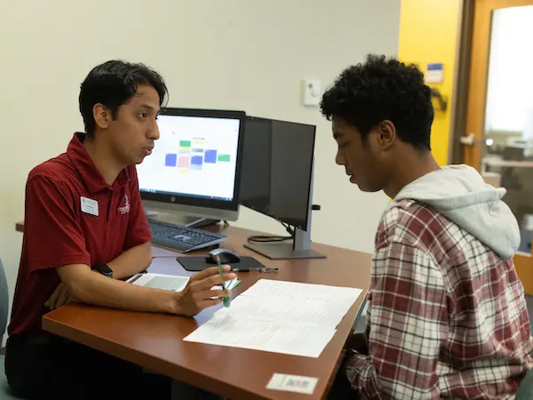 a student getting help from a tutor