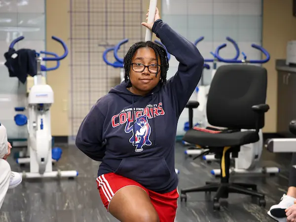 A student practicing exercise techniques