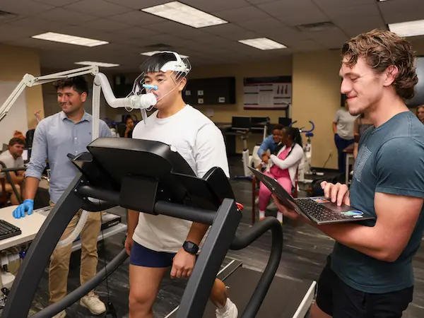 students working with fitness testing equipment