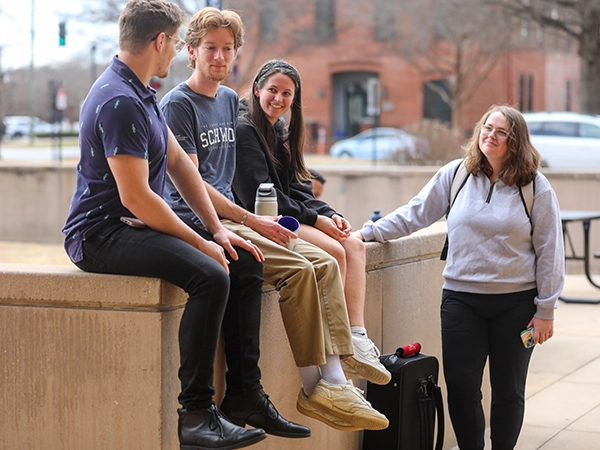Four students hanging out together in downtown Columbus