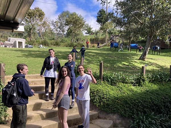 A group of students overseas on a study abroad trip, relaxing after a long day