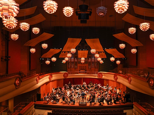 A beautiful symphony hall where the symphony is practicing.