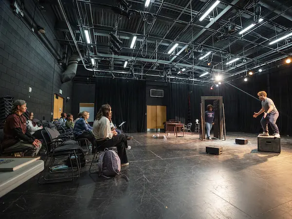 students learning and practicing on stage