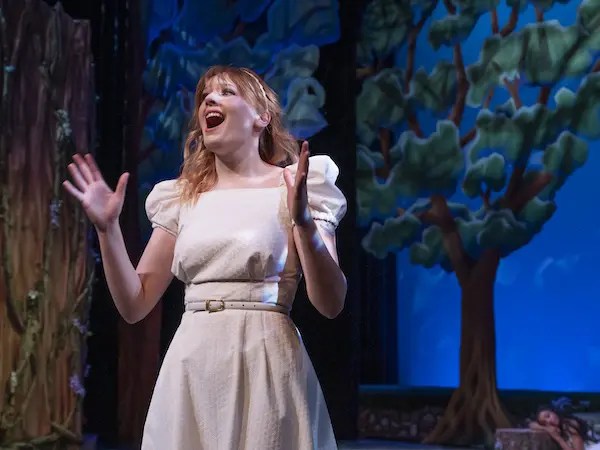 a student on stage singing