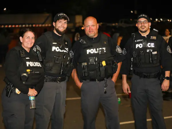four policeman standing together