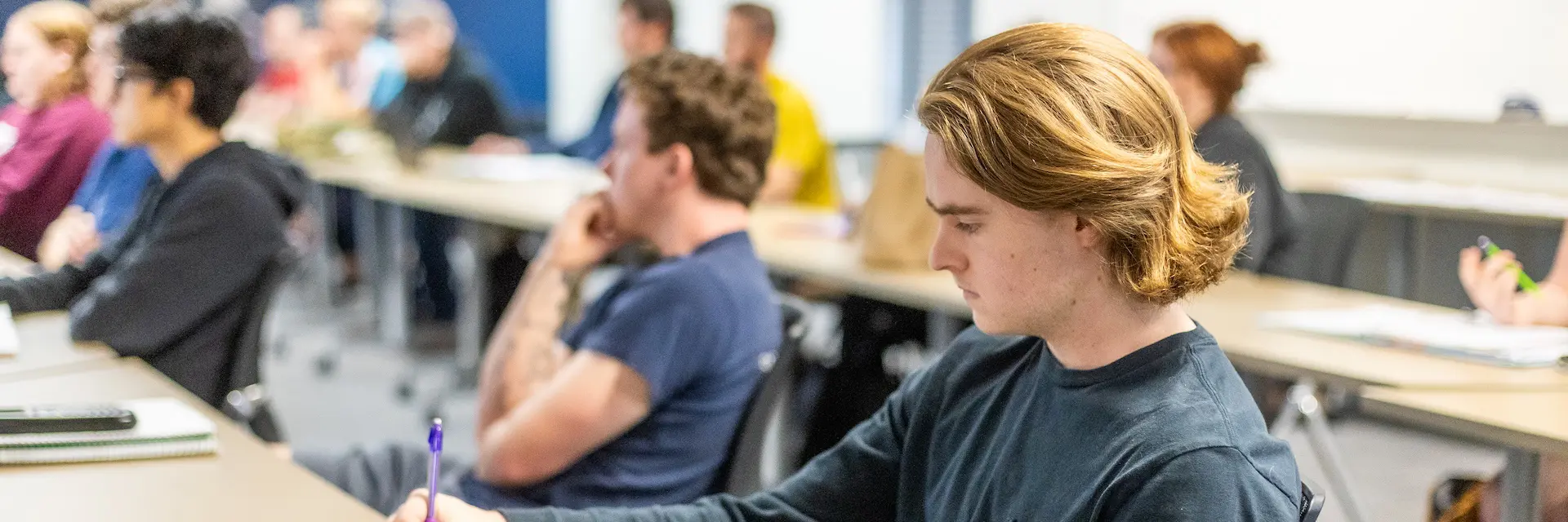 students at desks in a classroom
