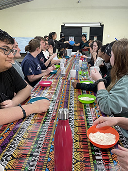 several students sitting at a table