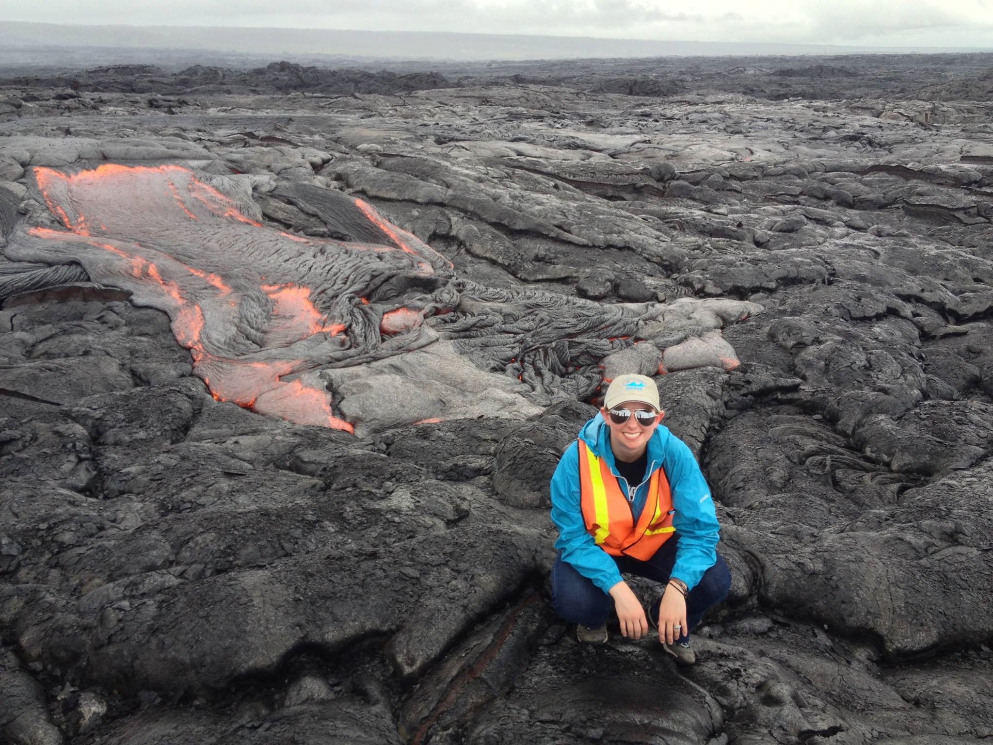 a female student standing in front of lava