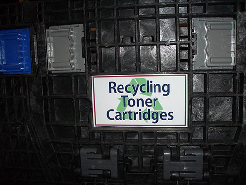 a sign that says Recyling Toner Catridges