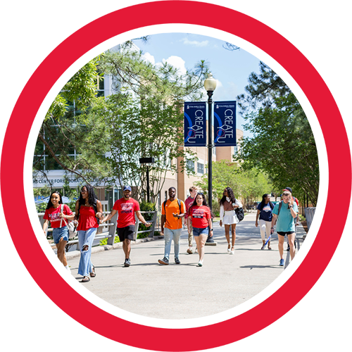 several students walking across a bridge