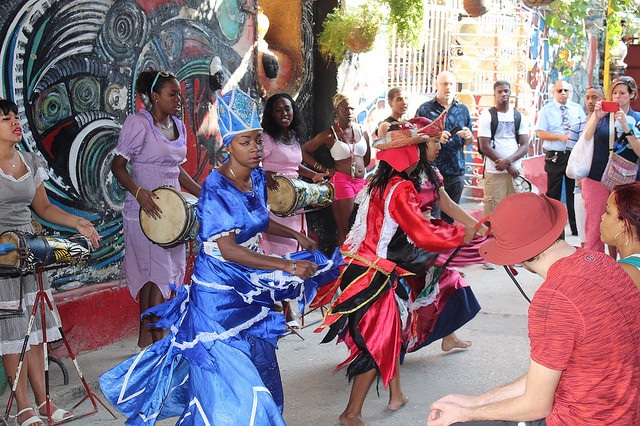 Several people dancing and playing instruments