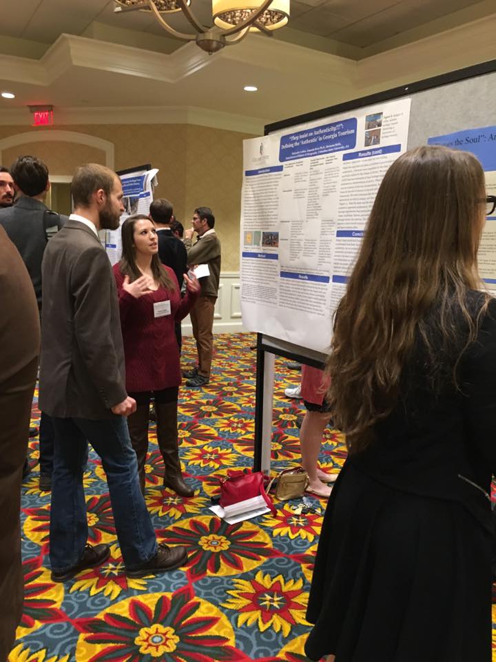 A student presents a poster at the 2016 SEDAAG conference