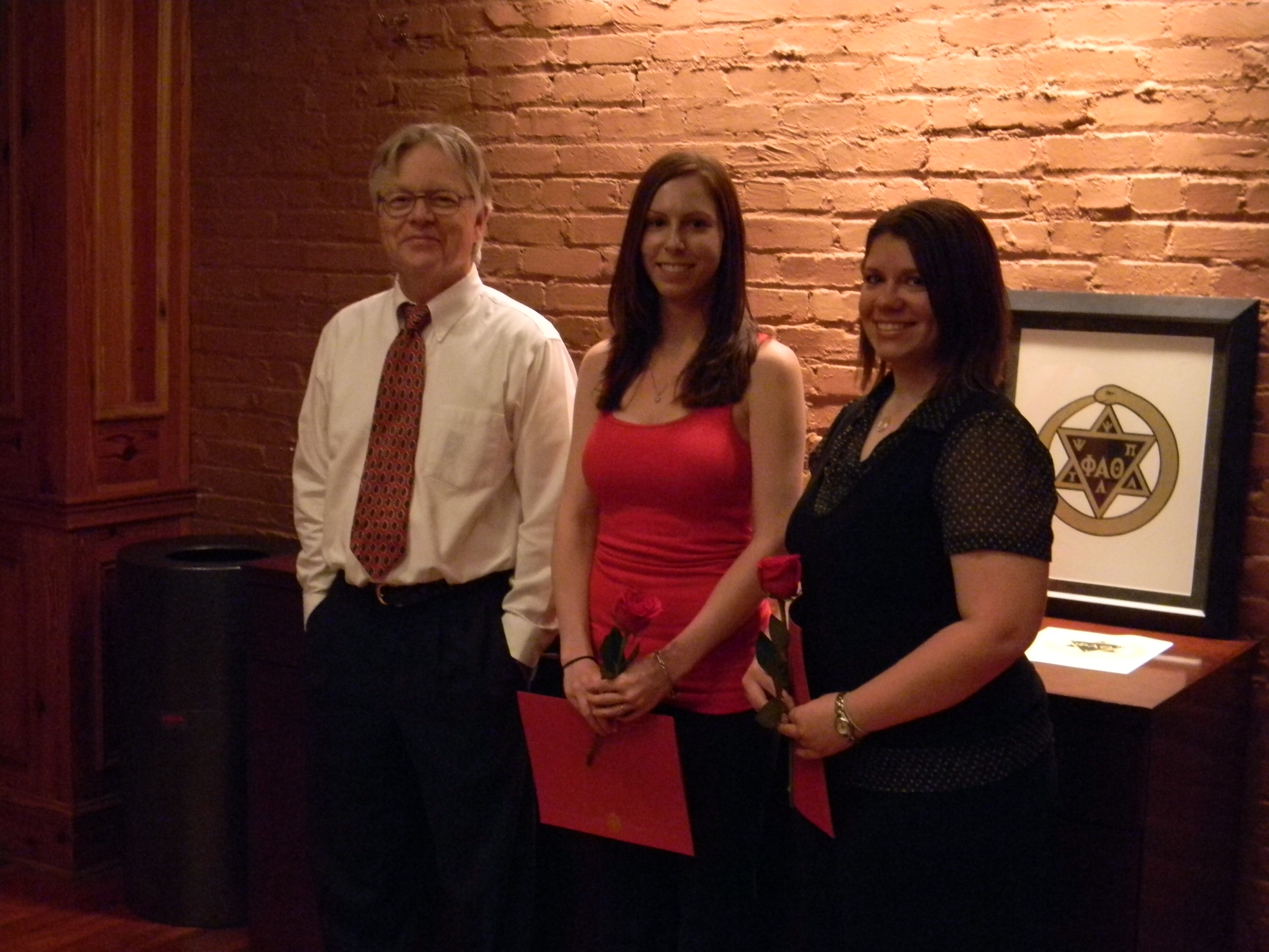 Dr. Ellisor and two students at a Phi Alpha Theta induction ceremony