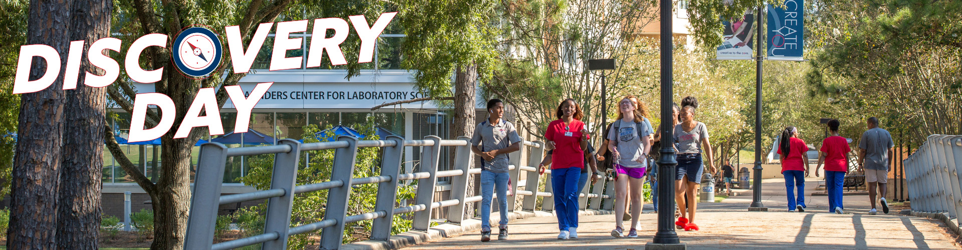 several students walking on a bridge, with the words Discovery Day overlayed
