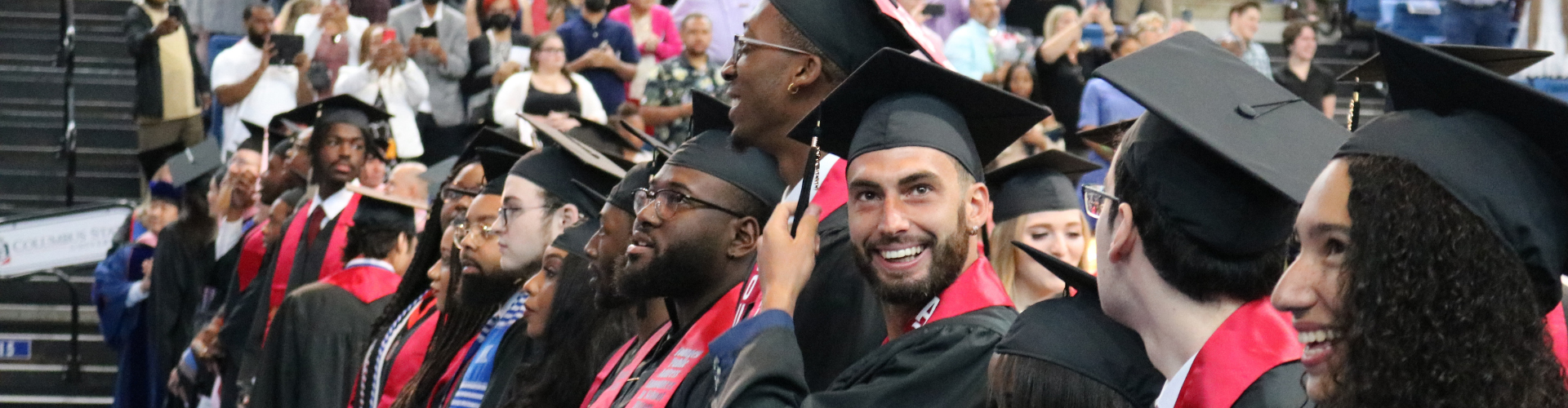multiple students wearing graduation regalia