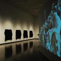 A large exhibit of a crowd of people 