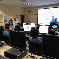 a computer lab with a number of students