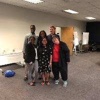 a group of people standing together for a group photo