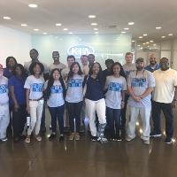 several students standing and posing for a group photo