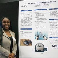 a female student standing in front of a presentation display