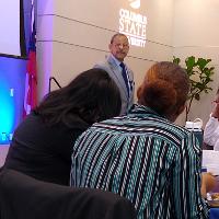 a man standing and talking