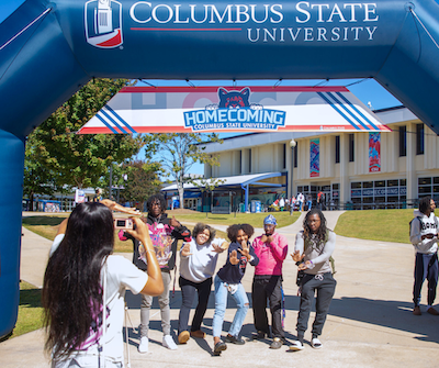 Students getting their picture taken at homecoming