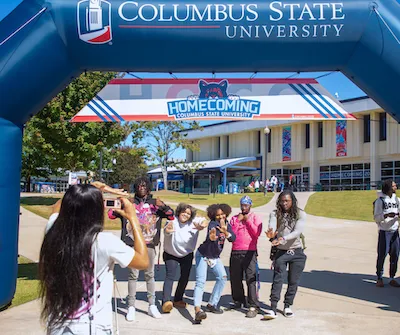 Students getting their picture taken at homecoming