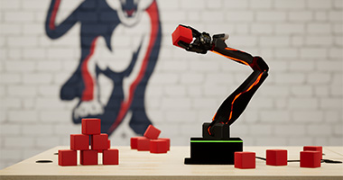 a robotic arm picking up small red cubes