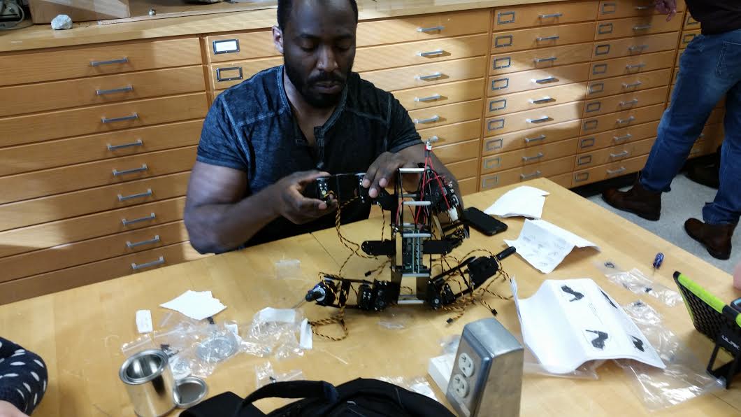 a male student working on a robot