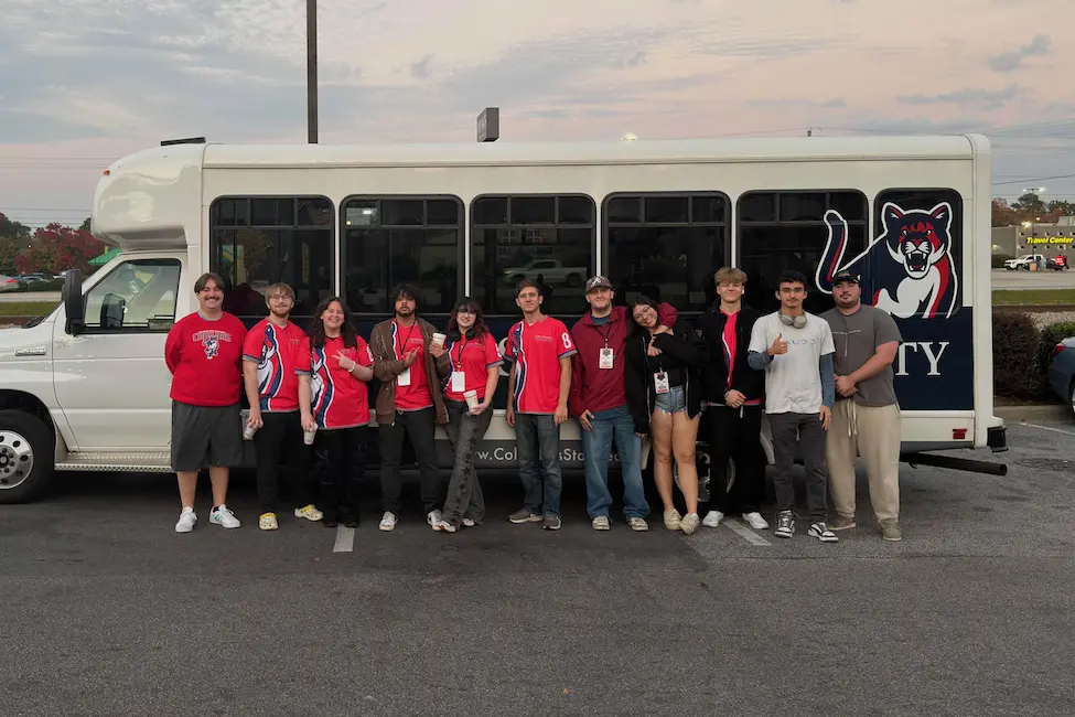 Students in front of a bus