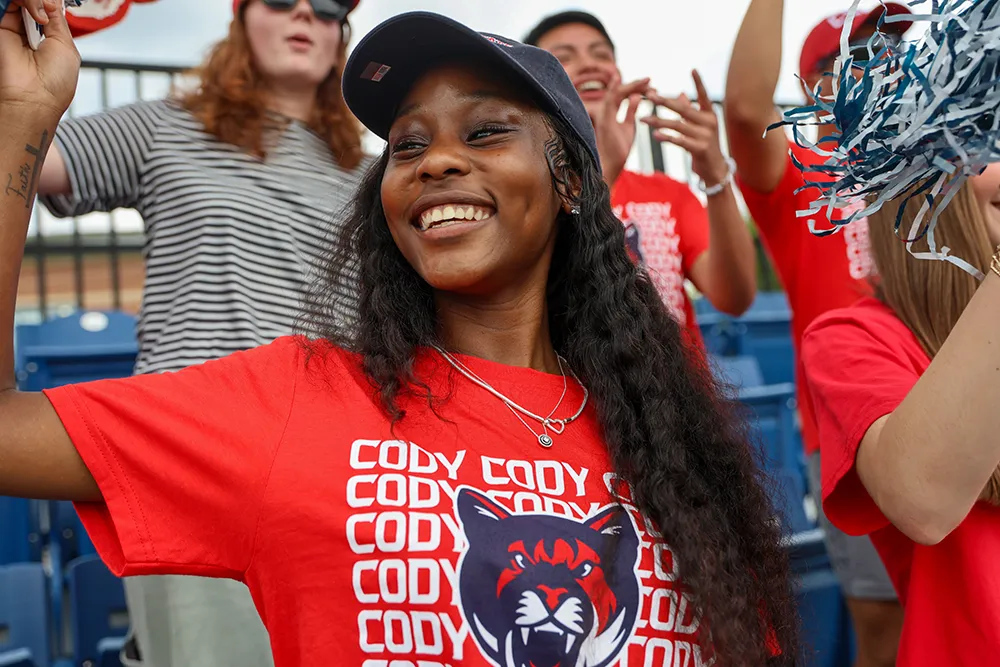 Students in CSU apparel cheering at an event